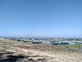 summer beach with seaweed and boats. Tropical sea in Bali Royalty Free Stock Photo