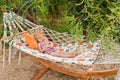 Summer beach tropical vacation with kids. Cute happy little caucausian girl laying in a hammock Royalty Free Stock Photo