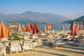 Summer beach vacation.  Beautiful Mediterranean landscape with beach umbrellas. Montenegro, Bay of Kotor, Tivat Royalty Free Stock Photo