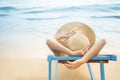 Summer beach vacation concept, Asia woman with hat relaxing and arm up on chair beach at Koh Mak, Trad, Thailand Royalty Free Stock Photo