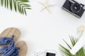 Summer beach vacation, woman sunbathing background, beach slippers, palm leaves, sunblock jar and smartphone copy space Royalty Free Stock Photo