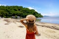 Summer beach vacation. Young woman with hat relaxing enjoying looking view of beach ocean on hot summer day in Brazil Royalty Free Stock Photo