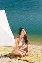 Summer beach young woman sunbathing in bikini Royalty Free Stock Photo