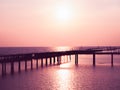 Summer beautiful seascape from Thailand, pink sky at sunset, warm sea, wooden bridge on horizon love feeling background Royalty Free Stock Photo