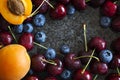 Summer berries and fruits. Sweet cherries, blueberries and apricots Royalty Free Stock Photo