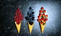 Summer berries in ice cream cones creative flatlay top view