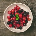 Summer berries in white bowl Royalty Free Stock Photo