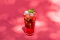 Summer Berry fruit iced tea with ice cubes against rose abstract background Royalty Free Stock Photo