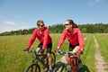 Summer bike - Young sportive couple in meadow Royalty Free Stock Photo