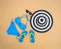 Summer bikini and accessories stylish beach set, Beach bikini summer outfit and sea sand as background, Top View, Concept Royalty Free Stock Photo