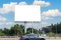 In summer, blue sky, highway and billboard. Outstanding advertising billboard at the sideways of public road Royalty Free Stock Photo