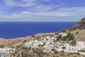 Summer bottom view of Rhodes Acropolis of Lindos with sea