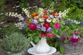summer bouquet in vase in garden setting