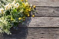 Summer bouquet of wildflowers on old wooden board background. Midsummer flowers. Royalty Free Stock Photo