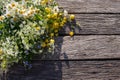 Summer bouquet of wildflowers on old wooden board background. Midsummer flowers. Royalty Free Stock Photo