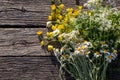 Summer bouquet of wildflowers on old wooden board background. Midsummer flowers. Royalty Free Stock Photo