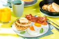 Summer breakfast - eggs, bacon, pancakes, cereal Royalty Free Stock Photo