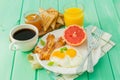 Summer breakfast - eggs, bacon, toast, jam, coffee, juice Royalty Free Stock Photo