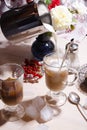 Summer breakfast with iced coffee, fresh red currant berries and milk pouring into a glass Royalty Free Stock Photo