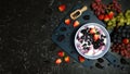 Summer breakfast with yoghurt and berries creative flatlay top view