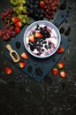 Summer breakfast with yoghurt and berries creative flatlay top view