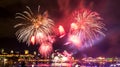 Summer 2018: Bright pink and orange fireworks Royalty Free Stock Photo