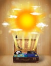 Summer bright sun with clouds and tourist bag Royalty Free Stock Photo