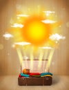 Summer bright sun with clouds and tourist bag Royalty Free Stock Photo