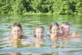 In summer  on a bright sunny day  small children swim in the lake Royalty Free Stock Photo