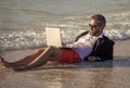 Summer business. Businessman relaxing at the beach. businessman relax at beach. businessman in suit with laptop in