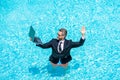 Summer business dreams. successful man. Businessman in suit with laptop in swimming pool. business man on summer Royalty Free Stock Photo