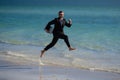 Summer business. Freelancer on summer sea beach. Business man in wet suit in sea water. Crazy business vacation. Funny