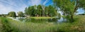 Gazebos on shore of pond in park of Kossovo village, Brest region, Belarus. Royalty Free Stock Photo