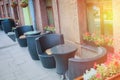 Summer cafe on the street of the big city. Outdoor restaurant veranda with wicker tables and chairs Royalty Free Stock Photo