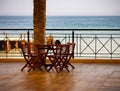 Summer cafe on the terrace overlooking the sea. Pier, shore, surf, Photography. Royalty Free Stock Photo