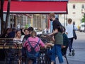 Summer cafes and restaurants have opened in the city center after the Covid-19 pandemic. People on the terrace, veranda, summer