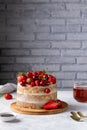 Summer cake with berries on a gray table in the kitchen Royalty Free Stock Photo