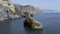 Summer calm landscape with the sea. Action.Huge piles of stones near the shore and you can see the deep sea in the Royalty Free Stock Photo