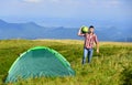 Summer camping. man hold watermelon. fruits and vitamins. mountain camping. man live in tent. hiking. mountain traveling