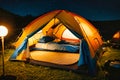Summer camping in the mountains. Tents in the night with the starry sky and clouds in the background. Royalty Free Stock Photo