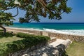 Summer caribbean coastline panoramic view, tropical green garden with stairs to the beach and stone wall Royalty Free Stock Photo