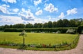 Summer in the castle garden with blue sky and white clouds