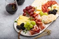 Summer charcuterie board with cheese, meat and fruit