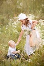 summer, children in daisies, in the field Royalty Free Stock Photo