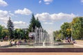 In summer, children relax in the park and bathe in the city fountain