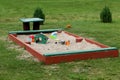 Summer children`s toys on the sand, a small sandbox. Latvia Royalty Free Stock Photo