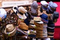 Summer in city. Street shop with summer headgear.