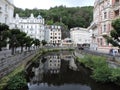 Old buildings, trees and river in Karlovy Vary, Czech Republic Royalty Free Stock Photo