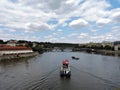 View of old buildings, river and ships, Prague, Czech Republic