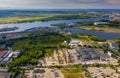 Summer cityscape of modern european city. Top drone view of warehouse.